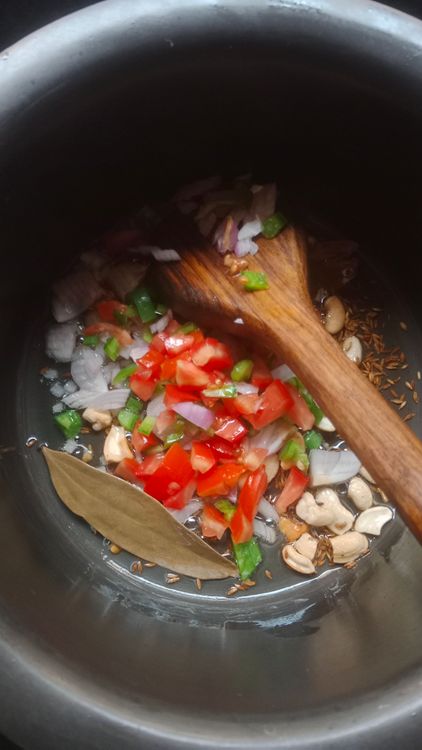 Step 2.1: Add chopped onion, tomato, and capsicum