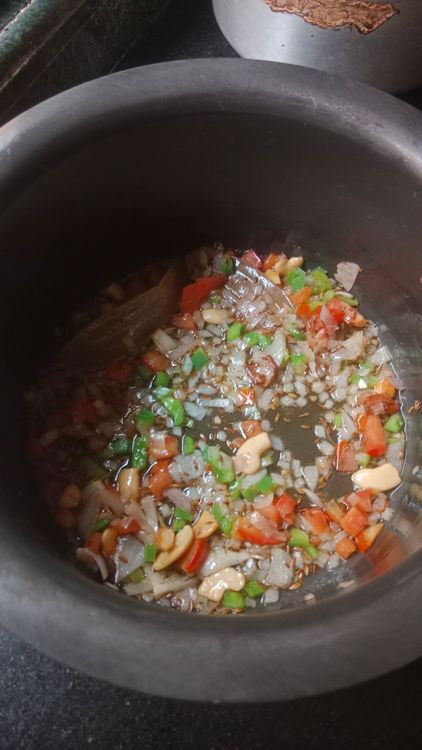 Step 2.2: Add chopped onion, tomato, and capsicum