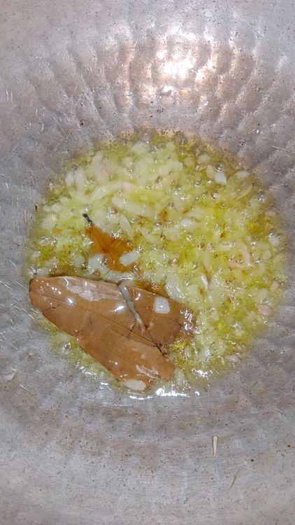 Step 2.1: Heat oil in a pan or kadhai
