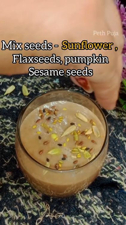 Step 1.2: Pour the smoothie into a glass and sprinkle some mixed seeds on top for garnish