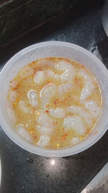 Step 2.2: Marinate cleaned prawns with egg , salt, chilli flakes and garlic powder for 10 min