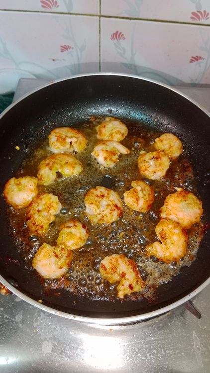 Step 2.2: In a pan , heat butter and add marinated prawns one by one