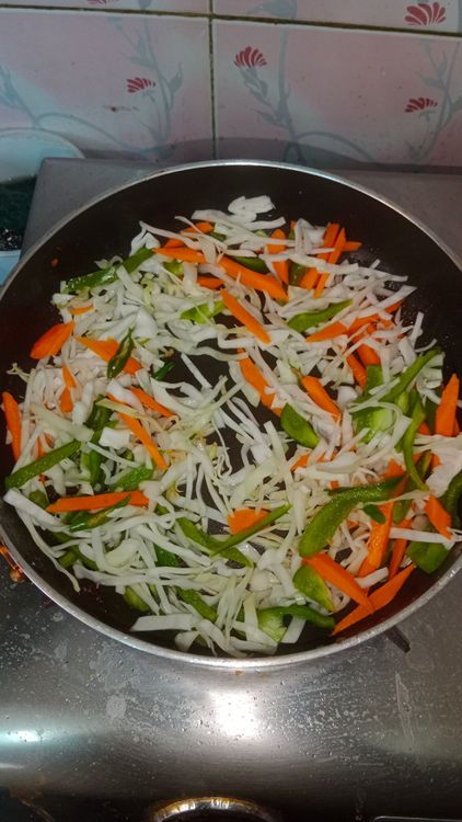 Step 3.1: In the same pan , heat oil , toss the mix veggies