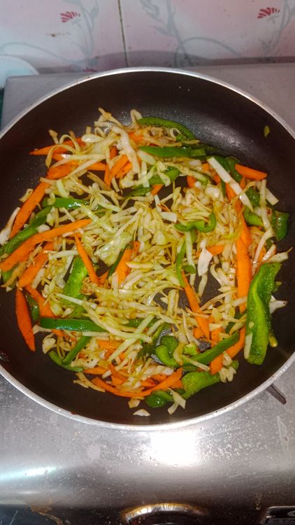 Step 3.2: In the same pan , heat oil , toss the mix veggies