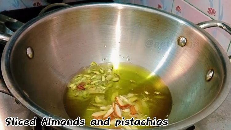 Step 1.1: Heat ghee in a pan and add almond flakes and chopped pistachio