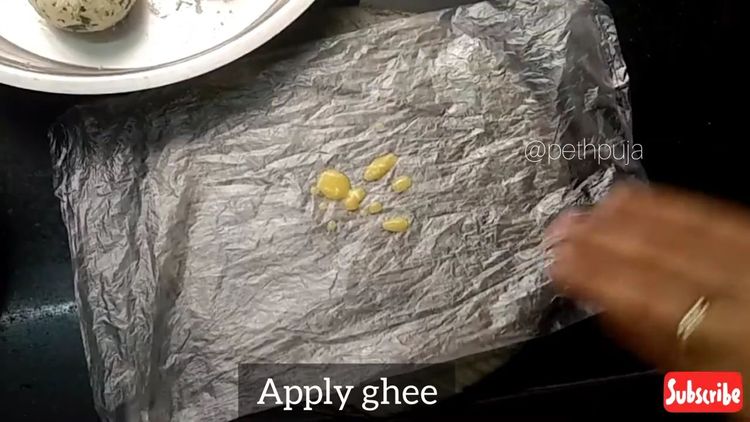 Step 1.1: Grease a butter paper or plastic cover with ghee
