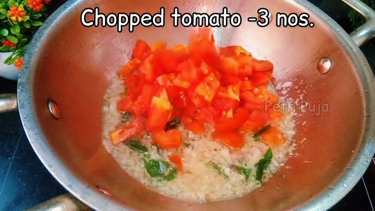 Step 1.1: Add the roughly chopped tomato and tomato puree