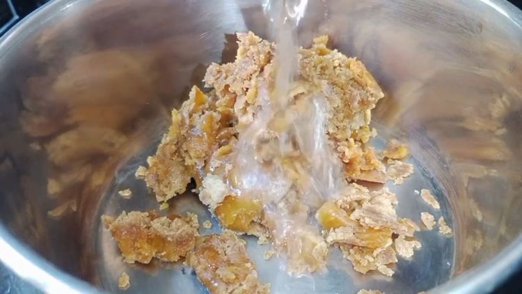 Step 1.1: In a pan, cook jaggery with water until it dissolves completely and becomes thick