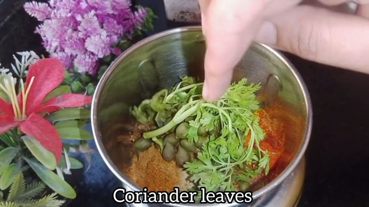 Step 1.2: In a mixie jar, add green chilli, ginger, coriander powder, pav bhaji masala, red chilli powder, turmeric powder, dry methi, cumin powder, raw mango powder, boiled green chana with stock, and a few coriander leaves