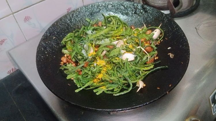 Step 1.3: Add the ridge gourd peels, salt, and turmeric powder