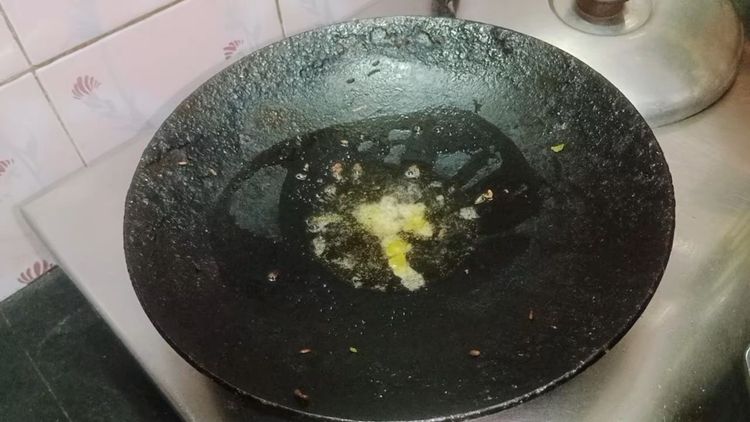 Step 1.1: In the same pan, heat oil and add a pinch of asafoetida