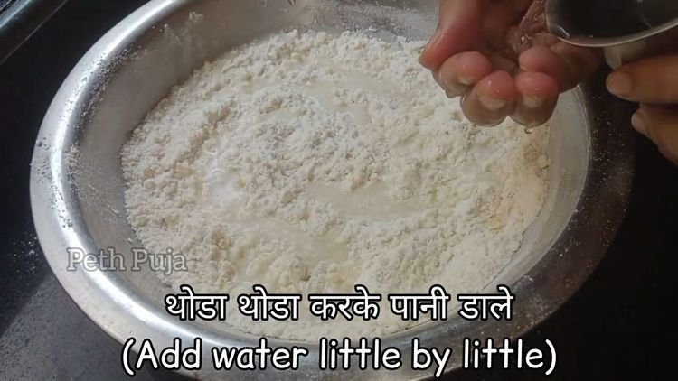 Step 1.3: Mix maida, salt, baking powder, suji, 1 spoon ghee till the mixture holds on your fist