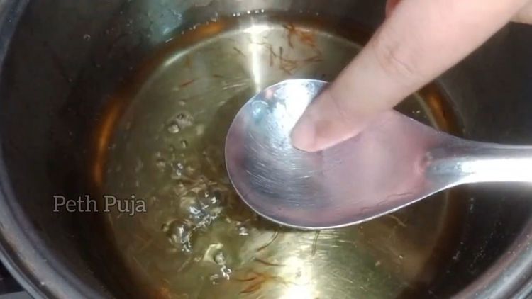 Step 2.2: In a pan, boil sugar and water on medium to low flame till slightly sticky (1- string consistency)