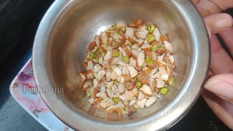 Step 3.1: When khoya cools down , add chopped dry fruits and cardamom-infused sugar