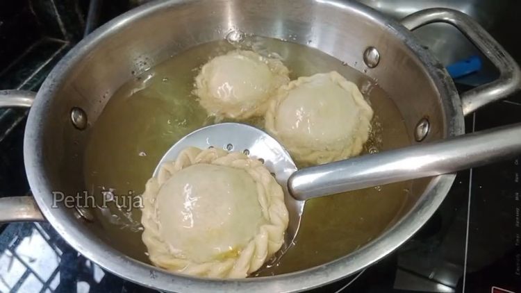 Step 5.1: Deep fry the Chandrakalas until they turn crispy, which takes about 5-7 minutes
