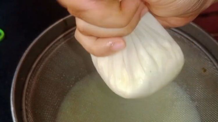 Step 1.2: Strain the curdled milk using a muslin cloth and wash it twice with cold water to remove the sourness