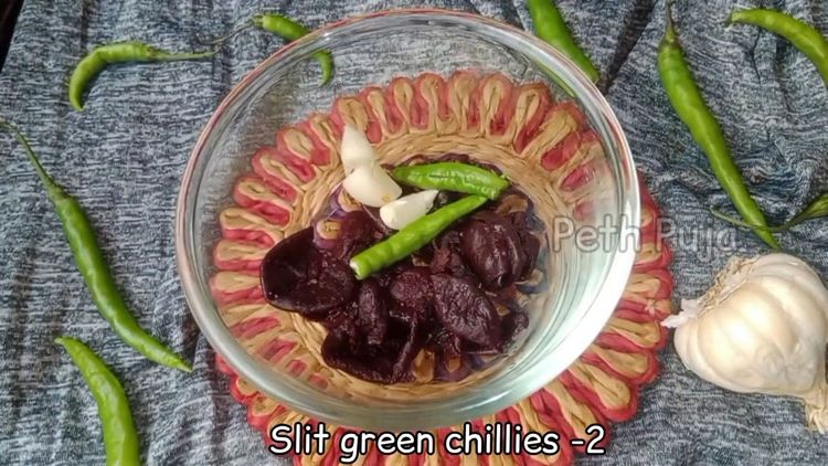 Step 1.1: Soak mangosteen (kokam) pieces, crushed garlic, green chillies, and asafoetida in warm water for 15-20 minutes