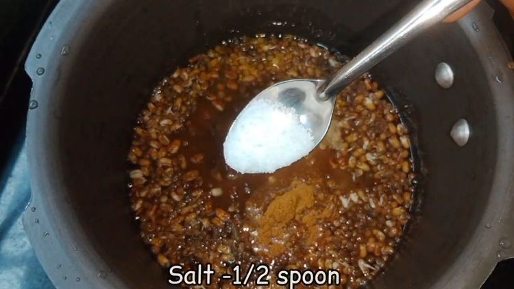 Step 1.2: In a pressure cooker, add sprouted matki, water, turmeric powder, red chilli powder, asafoetida, and salt