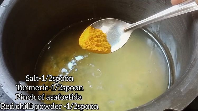 Step 1.2: Pressure cook the soaked dal for 3-4 whistles by adding turmeric powder, red chilli powder, asafoetida, salt, and oil
