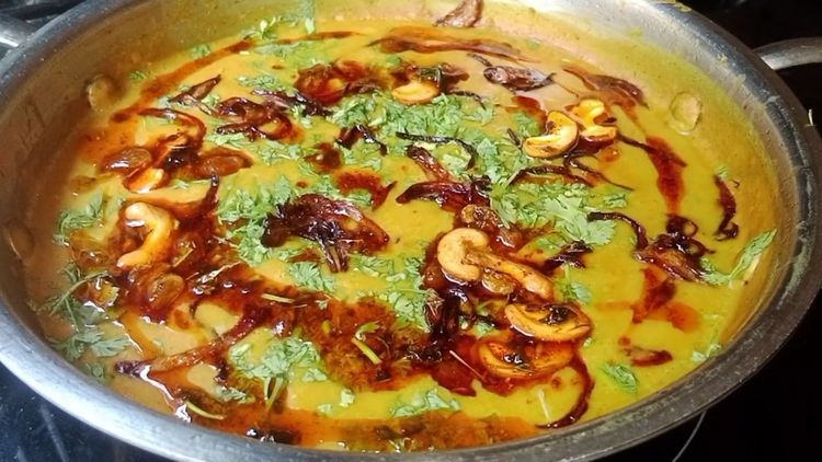 Step 4.1: Garnish the dal with coriander leaves, fried onions, and drizzle some cream for richness (optional)