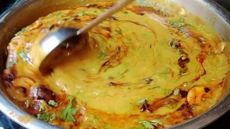 Step 4.2: Garnish the dal with coriander leaves, fried onions, and drizzle some cream for richness (optional)