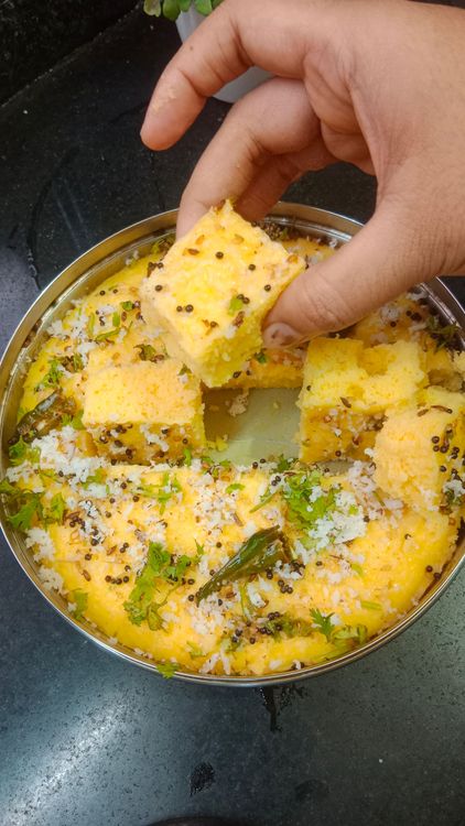 Step 4.2: Garnish the Khaman with shredded coconut and fresh coriander leaves