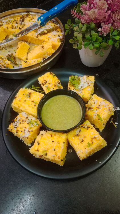 Step 4.1: Garnish the Khaman with shredded coconut and fresh coriander leaves