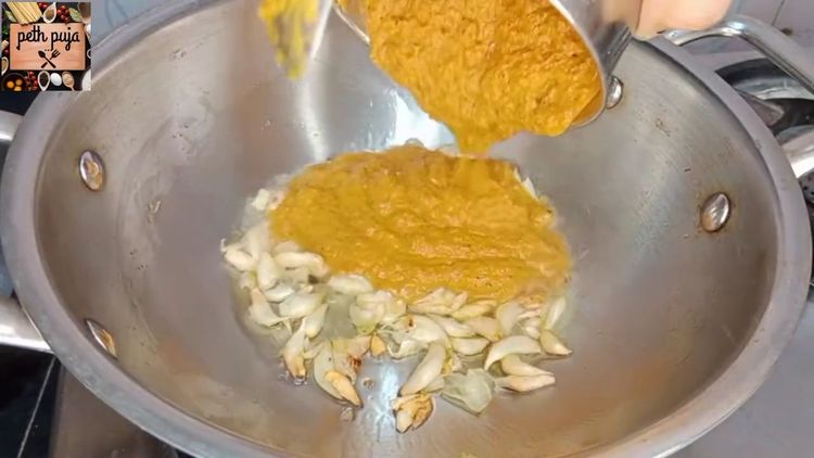 Step 2.1: Add the prepared spice paste to the pan and simmer until the oil separates