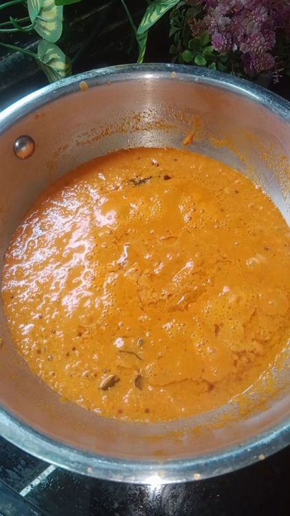 Step 1.2: Add the tomato paste to the pan, mix well, and let it simmer until the oil separates