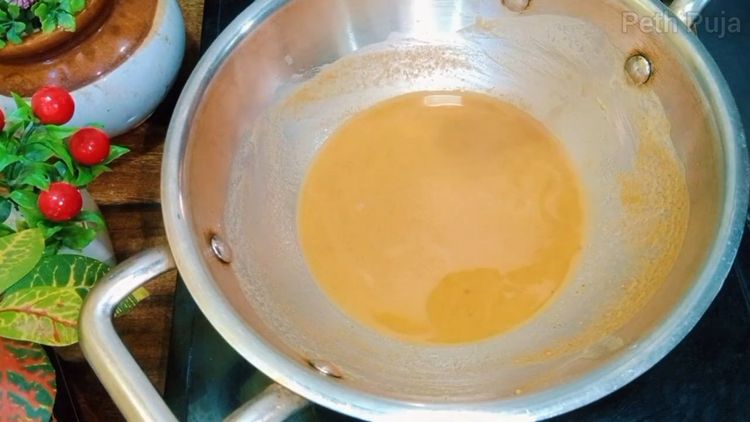 Step 1.2: Once the flour changes color to brownish biscuit shade, dissolve sugar into the mixture