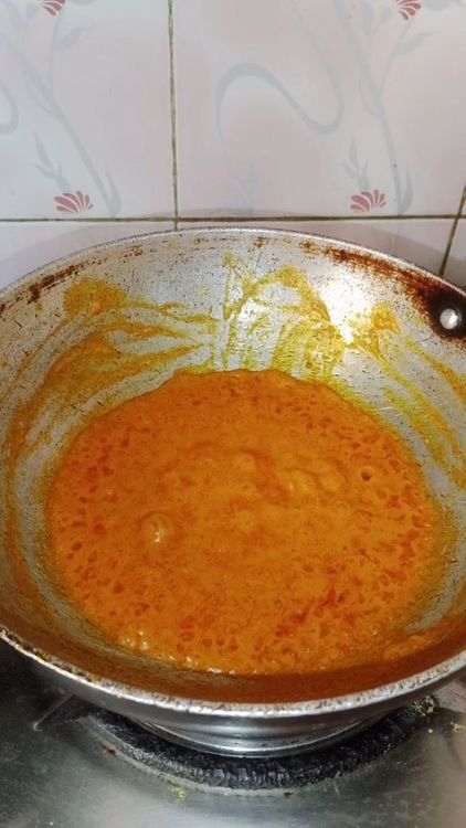 Step 2.2: Heat oil in a pan and add the tomato-cashew puree