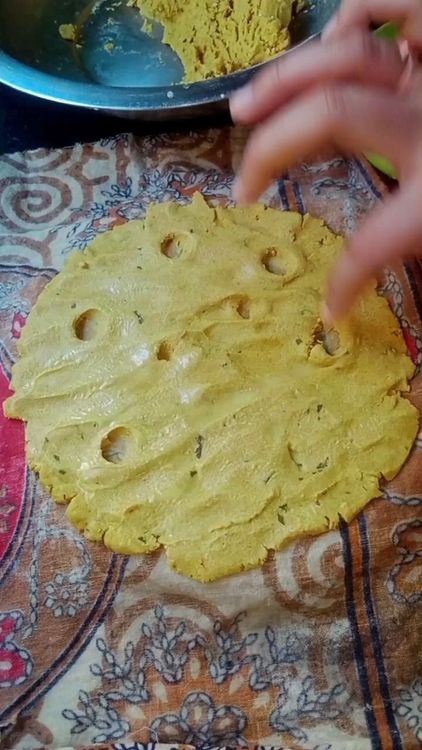 Step 1.2: Take a medium-sized ball of the dough and place it on a wet cloth