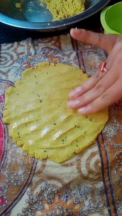 Step 1.1: Take a medium-sized ball of the dough and place it on a wet cloth