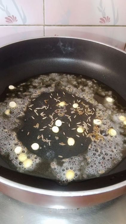 Step 1.1: Heat oil in a pan and crackle mustard seeds, cumin seeds, daliya, and asafoetida