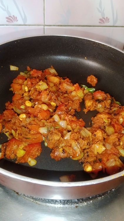 Step 1.2: Add roasted besan, cover the pan, and simmer for 2 minutes