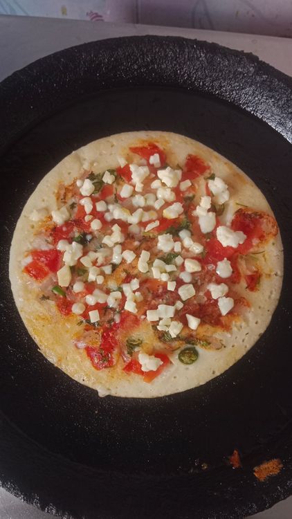 Step 3.1: Spread the tomato onion mixture on top of the batter
