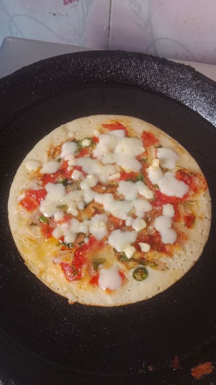 Step 3.1: Flip again, add mozzarella cheese and chilli flakes, cover, and fry for a few seconds