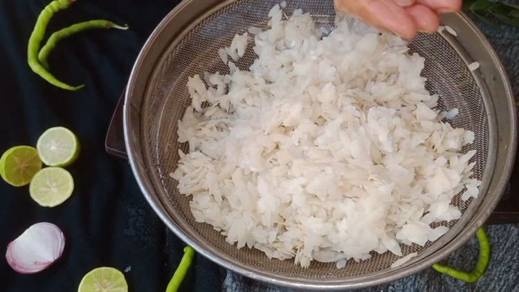 Step 1.1: Sieve and wash the flattened rice gently under running water