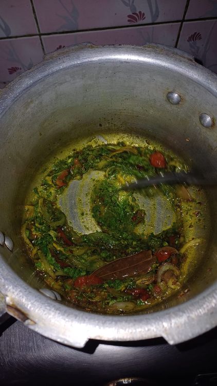 Step 2.2: Add the green paste along with salt, turmeric, and coriander powder
