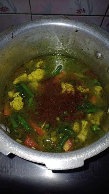 Step 2.1: Add the soaked rice and 2 cups of hot water