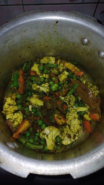 Step 2.1: Add the chopped vegetables and peas