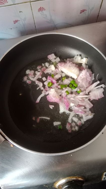 Step 2.1: Heat oil in a pan and sauté finely chopped onion and green chilli for a minute