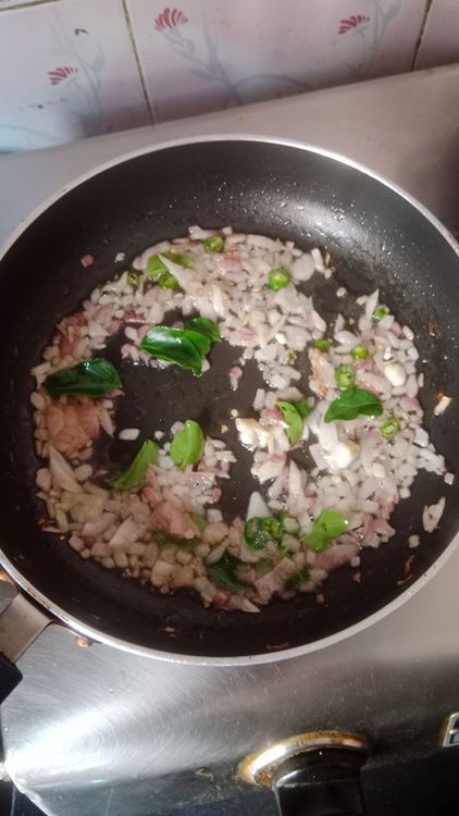 Step 2.1: Add curry leaves and the prepared coconut paste along with salt