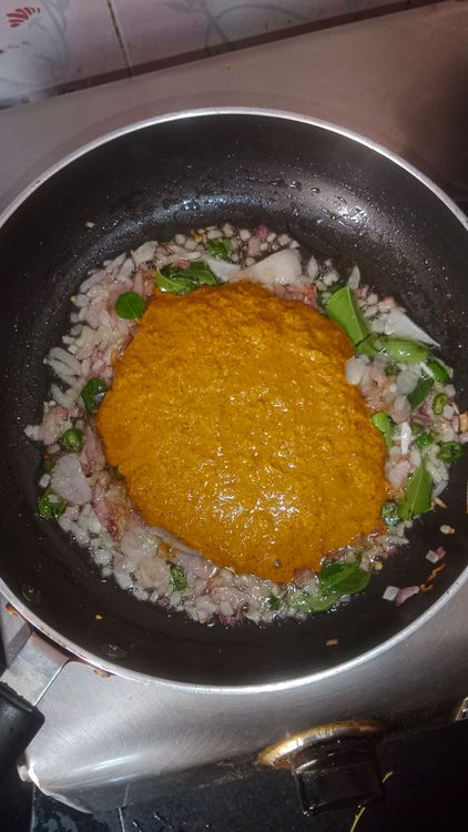 Step 2.2: Add curry leaves and the prepared coconut paste along with salt
