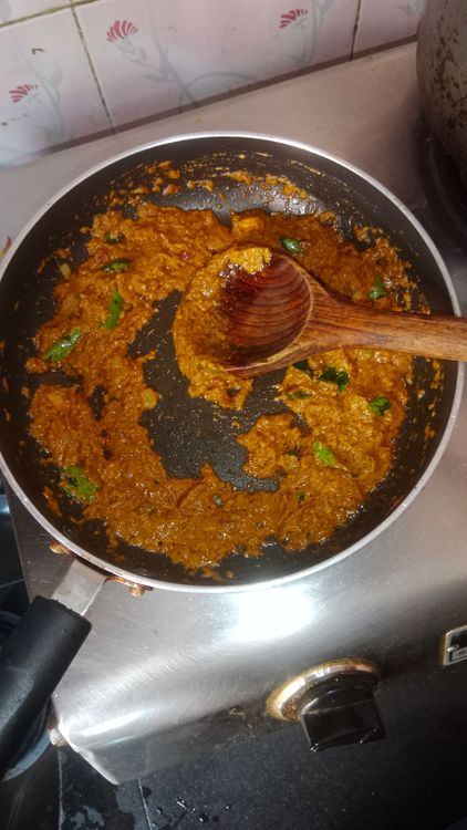 Step 2.3: Add curry leaves and the prepared coconut paste along with salt