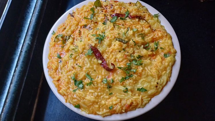Step 3.1: Garnish the dal khichdi with coriander leaves and serve hot with pickle and soup-salad