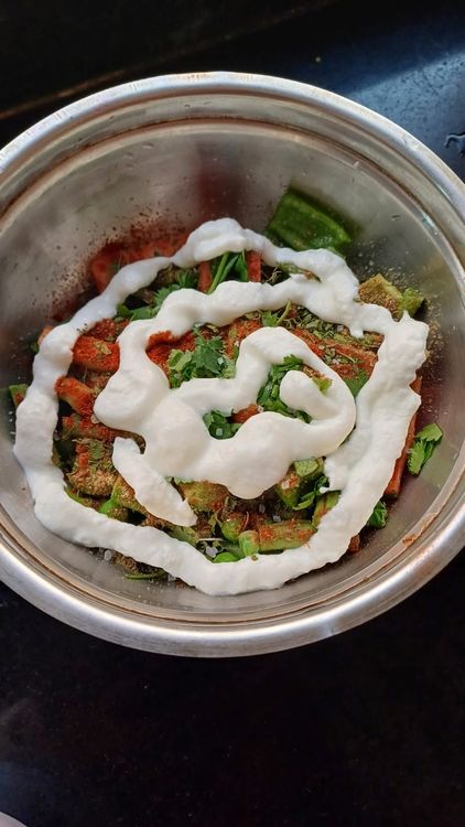 Step 2.1: Combine the vegetables with curd, turmeric powder, coriander cumin powder, kashmiri red chilli powder, achari masala, ginger garlic paste, salt, coriander leaves, and mint leaves