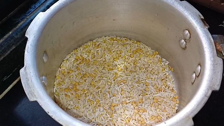 Step 1.2: In a pressure cooker, add long grain basmati rice, toor dal, moong dal, and urad dal