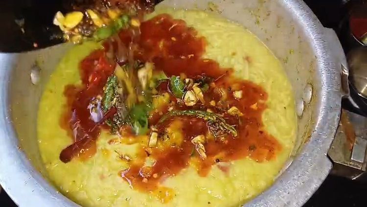 Step 2.1: Finally, add kashmiri red chilli powder and quickly pour the tadka over the dal khichdi