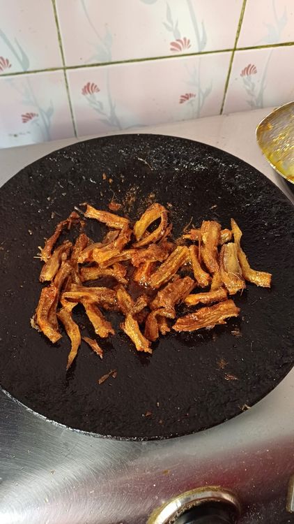 Step 1.1: Splash a few drops of water to prevent the masalas from burning